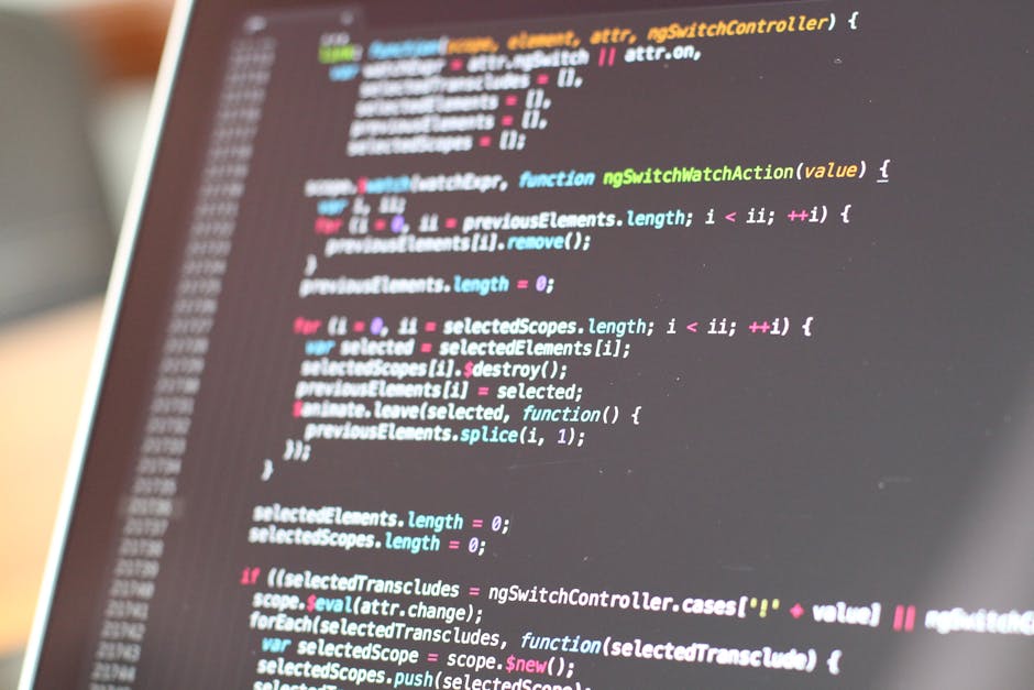 A close-up view of a computer screen displaying lines of colorful programming code in various shades of blue, pink, yellow, and white. The code appears to be JavaScript or a similar language, with fun